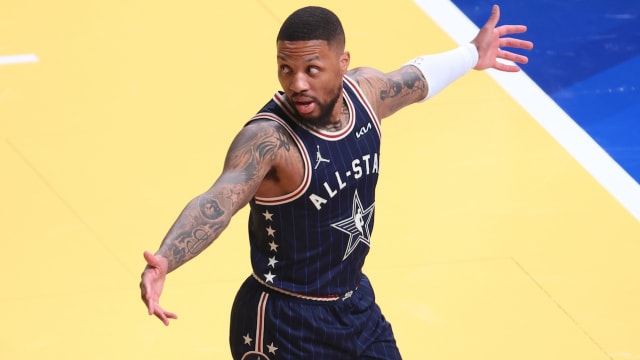 Eastern Conference guard Damian Lillard of the Milwaukee Bucks reacts after making a three-point basket from half court against the Western Conference All-Stars during the third quarter in the 73rd NBA All-Star Game at Gainbridge Fieldhouse in Indianapolis on Feb. 18, 2024.