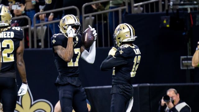 New Orleans Saints wide receiver A.T. Perry (17) celebrates a touchdown with wide receiver Chris Olave (12)