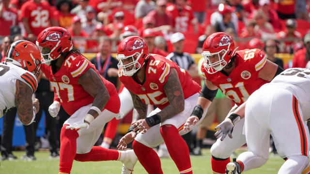 Aug 26, 2023; Kansas City, Missouri, USA; Kansas City Chiefs offensive tackle Lucas Niang (77) and offensive tackle Darian Kinnard (75) and center Austin Reiter (61) on the line of scrimmage against the Cleveland Browns during the game at GEHA Field at Arrowhead Stadium. Mandatory Credit: Denny Medley-USA TODAY Sports  