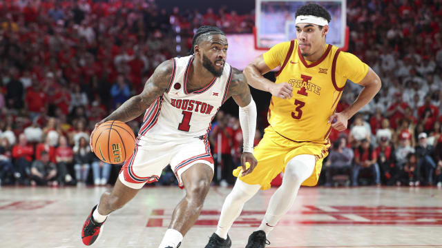 Houston Cougars guard Jamal Shead (1) drives with the ball as Iowa State Cyclones guard Tamin Lipsey (3) defends during the second half at Fertitta Center. 