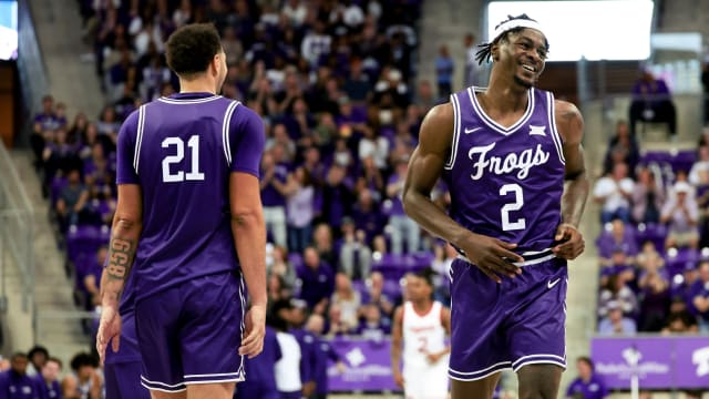 TCU Horned Frogs forward Emanuel Miller (2) celebrates with TCU Horned Frogs forward JaKobe Coles (21) during the second half against the Cincinnati Bearcats at Ed and Rae Schollmaier Arena.