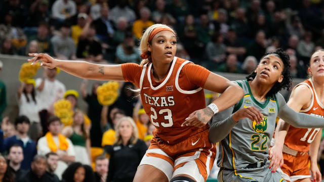 Feb 1, 2024; Waco, Texas, USA; Texas Longhorns forward Aaliyah Moore (23) and Baylor Lady Bears guard Bella Fontleroy (22) battle for position during the second half at Paul and Alejandra Foster Pavilion. 