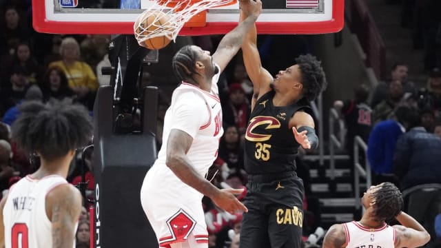 Cleveland Cavaliers forward Isaac Okoro (35) dunks the ball on Chicago Bulls center Andre Drummond (3) during the first quarter at United Center