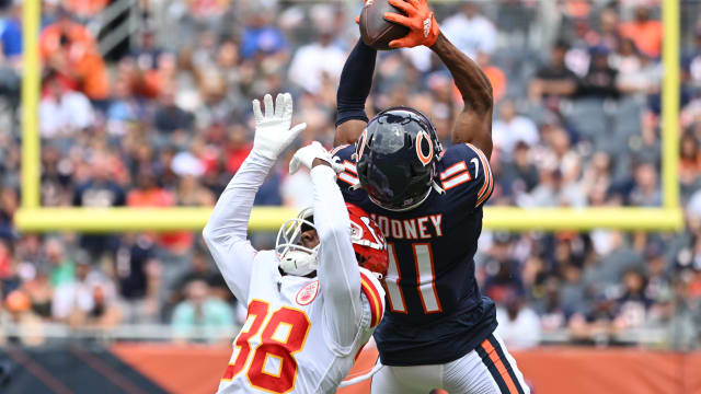 Aug 13, 2022; Chicago, Illinois, USA; Chicago Bears wide receiver Darnell Mooney (11) pulls in a 26-yard reception over Kansas City Chiefs cornerback L'Jarius Sneed (38) in the first quarter at Soldier Field. Mandatory Credit: Jamie Sabau-USA TODAY Sports  