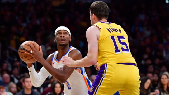 Oklahoma City Thunder guard Shai Gilgeous-Alexander (2) controls the ball against Los Angeles Lakers guard Austin Reaves (15) during the second half at Crypto.com Arena in Los Angeles on March 4, 2024.