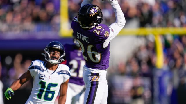 Baltimore Ravens safety Geno Stone (26) catches an interception against the Seattle Seahawks during the first half at M&T Bank Stadium.