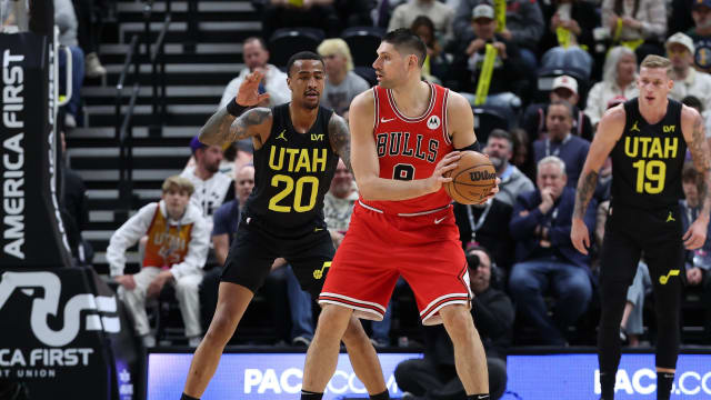 Chicago Bulls center Nikola Vucevic (9) posts up against Utah Jazz forward John Collins (20) during the first quarter at Delta Center.