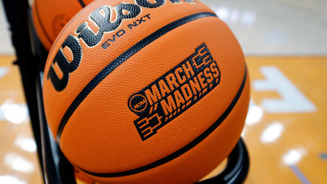 The NCAA March Madness logo is shown on a basketball.