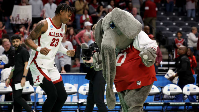 Alabama Crimson Tide forward Nick Pringle (23) celebrates with the mascot after defeating the Maryland Terrapins at Legacy Arena.
