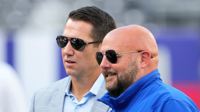 Aug 26, 2023; East Rutherford, New Jersey, USA; New York Giants head coach Brian Daboll (right) and general manager Joe Schoen (left) talk before a game against the New York Jets at MetLife Stadium.