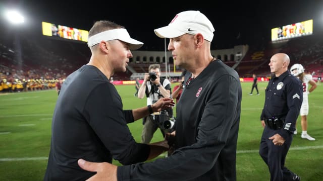 Sep 9, 2023; Los Angeles, California, USA; Southern California Trojans head coach Lincoln Riley (left) talks with Stanford Cardinal head coach Troy Taylor after the game at United Airlines Field at Los Angeles Memorial Coliseum. Mandatory Credit: Kirby Lee-USA TODAY Sports