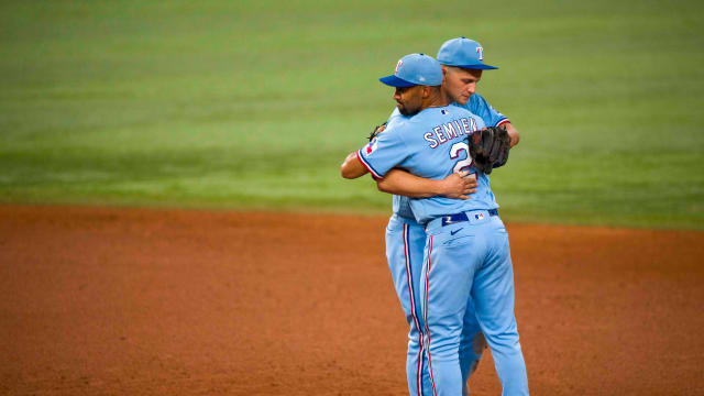 Sep 10, 2023; Arlington, Texas, USA; Texas Rangers second baseman Marcus Semien (2) and shortstop Corey Seager (5) celebrate the Rangers victory over the Oakland Athletics at Globe Life Field. Mandatory Credit: Jerome Miron-USA TODAY Sports