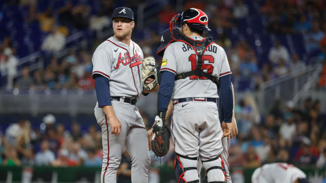 Sep 15, 2023; Miami, Florida, USA; Atlanta Braves starting pitcher Bryce Elder (55) and catcher Travis d'Arnaud (16) stand on the mound between batters against the Miami Marlins during the first inning at loanDepot Park.