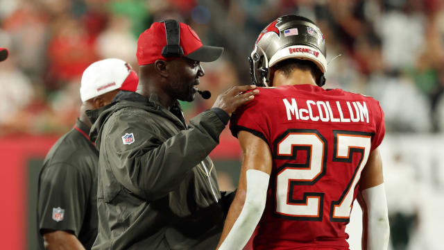 Sep 25, 2023; Tampa, Florida, USA; Tampa Bay Buccaneers head coach Todd Bowles talks with cornerback Zyon McCollum (27) against the Philadelphia Eagles during the first half at Raymond James Stadium. Mandatory Credit: Kim Klement Neitzel-USA TODAY Sports  
