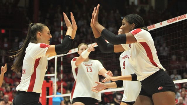 Wisconsin's Izzy Ashburn (left) and Devyn Robinson celebrate a point during the volleyball team's sweep of Indiana at the UW Field House in Madison, Wis. on Sunday Sept. 23, 2023.