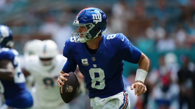 Oct 8, 2023; Miami Gardens, Florida, USA; New York Giants quarterback Daniel Jones (8) scrambles with the ball against the Miami Dolphins during the first half at Hard Rock Stadium.
