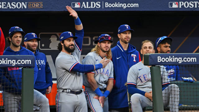 The Texas Rangers dugout reacts during the fifth inning against the Baltimore Orioles during Game 2 of the ALDS at Camden Yards in Baltimore. Texas took a 2-0 ALDS lead with an 11-8 win on Sunday.