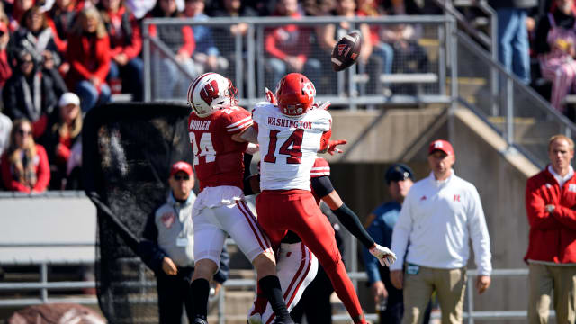 Oct 7, 2023; Madison, Wisconsin, USA; Wisconsin Badgers safety Hunter Wohler (24) defends the pass intended for Rutgers Scarlet Knights wide receiver Isaiah Washington (14) during the third quarter at Camp Randall Stadium. Mandatory Credit: Jeff Hanisch-USA TODAY Sports