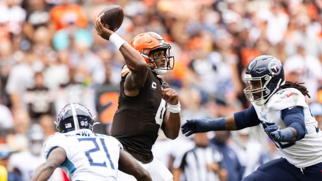 Sep 24, 2023; Cleveland, Ohio, USA; Cleveland Browns quarterback Deshaun Watson (4) throws the ball as Tennessee Titans cornerback Roger McCreary (21) and defensive end Denico Autry (96) pressure him during the first quarter at Cleveland Browns Stadium. 