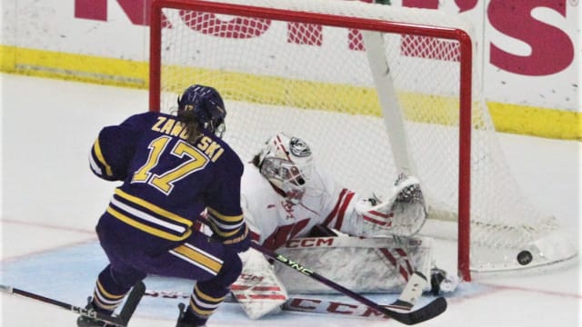 Wisconsin goaltender Jane Gervais stops a shot by Minnesota State's Lauren Zawoyski (17) during the second period at LaBahn Arena in Madison, Wisconsin on Thursday Oct. 12, 2023.