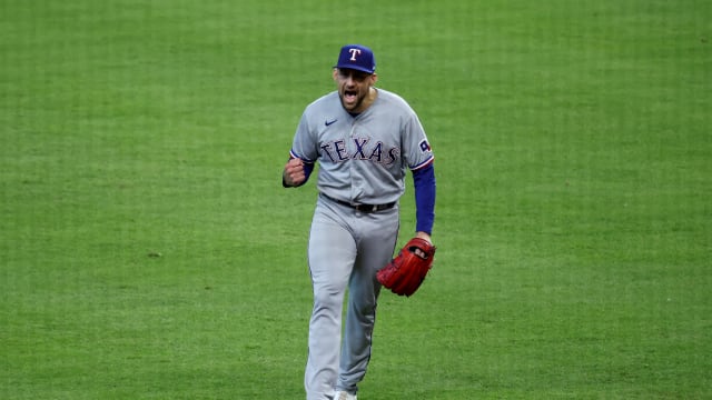 Texas Rangers starting pitcher Nathan Eovaldi reacts after escaping a bases-loaded jam with no outs in the fifth inning against the Houston Astros during Game 2 of the ALCS Monday at Minute Maid Park.