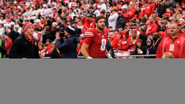Oct 14, 2023; Madison, Wisconsin, USA; Wisconsin Badgers quarterback Tanner Mordecai (8) runs to the locker room during the second quarter against the Iowa Hawkeyes at Camp Randall Stadium. Mandatory Credit: Jeff Hanisch-USA TODAY Sports