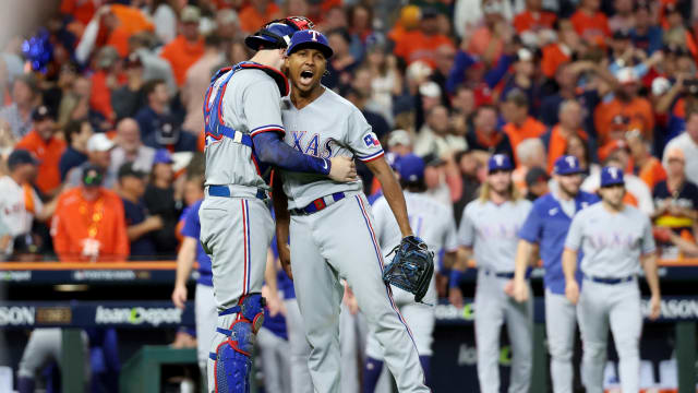 Texas Rangers relief pitcher Jose Leclerc, right, and catcher Jonah Heim celebrate their 5-4 win over the Houston Astros in Game 2 of the ALCS Monday at Minute Maid Park in Houston. It's Leclerc's third save in the 2023 postseason and second in the ALCS.