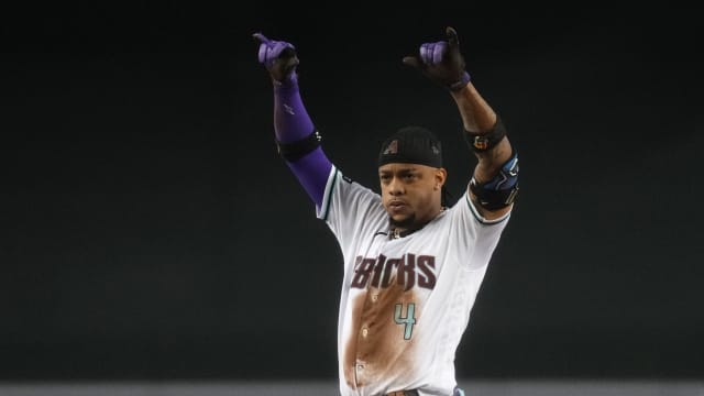 Ketel Marte (4) celebrates after hitting a double off Ranger Suarez in the 6th inning at Chase Field.