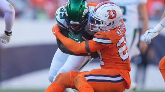 Jets' RB Dalvin Cook gets wrapped up on a carry in Denver