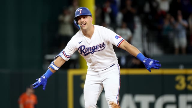Texas Rangers first baseman Nathaniel Lowe reacts after a double during the second inning in Game 4 of the ALCS against the Houston Astros on Oct. 19.