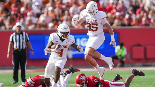 Texas running back CJ Baxter (4) carries the ball forward during the Longhorns game against the University of Houston at TDECU Stadium on Saturday, Oct. 21, 2023.