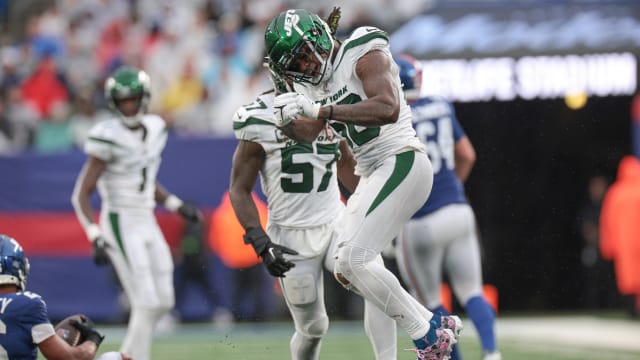 Jets' LB Quincy Williams celebrates a stop vs. the Giants
