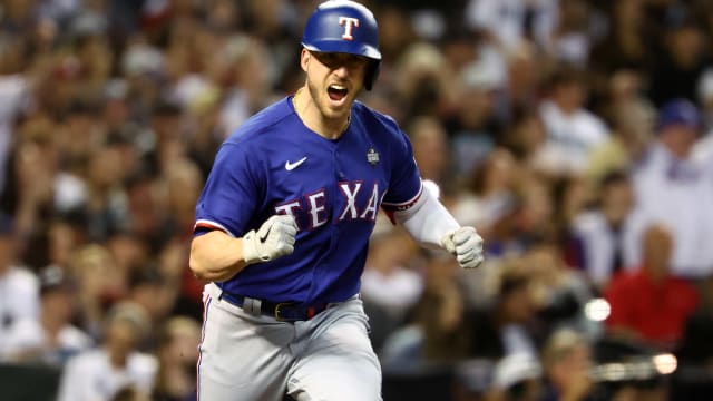 Texas Rangers catcher Mitch Garver reacts after hitting a go-ahead RBI single against the Arizona Diamondbacks in the seventh inning in Game 5 of the 2023 World Series Wednesday night at Chase Field in Phoenix.