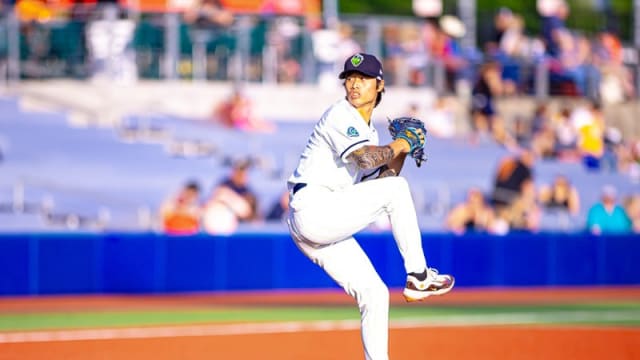 Yu-Min Lin winds up to throw pitch for Hillsboro Hops