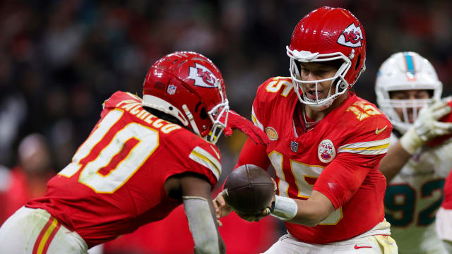 Nov 5, 2023; Frankfurt, Germany, ; Kansas City Chiefs quarterback Patrick Mahomes (15) hands off to running back Isiah Pacheco (10) in the fourth quarter during an NFL International Series game at Deutsche Bank Park. Mandatory Credit: Nathan Ray Seebeck-USA TODAY Sports  
