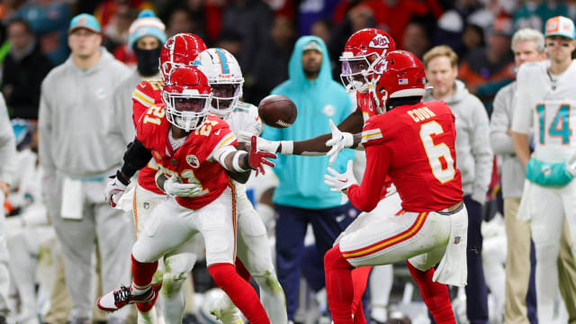 Nov 5, 2023; Frankfurt, Germany, ; Kansas City Chiefs safety Mike Edwards (21) tosses the ball back to safety Bryan Cook (6) against the Miami Dolphins in the second quarter during an NFL International Series game at Deutsche Bank Park. Mandatory Credit: Nathan Ray Seebeck-USA TODAY Sports  