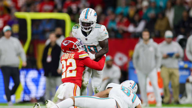 Nov 5, 2023; Frankfurt, Germany, ; Kansas City Chiefs cornerback Trent McDuffie (22) forces a fumble by Miami Dolphins wide receiver Tyreek Hill (10) in the second quarter during an NFL International Series game at Deutsche Bank Park. Mandatory Credit: Nathan Ray Seebeck-USA TODAY Sports  