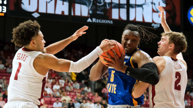 Nov 6, 2023; Tuscaloosa, Alabama, USA; Alabama guard Mark Sears (1) and Alabama forward Grant Nelson (2) guard Morehead State forward Zach Iyeyemi (5) as he attempts to move in the lane in the game at Coleman Coliseum. Mandatory Credit: Gary Cosby Jr.-USA TODAY Sports