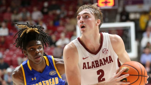 Nov 6, 2023; Tuscaloosa, Alabama, USA; Alabama forward Grant Nelson (2) drives past Morehead State guard Eddie Ricks (4) on his way to the hoop in the game at Coleman Coliseum. Mandatory Credit: Gary Cosby Jr.-USA TODAY Sports