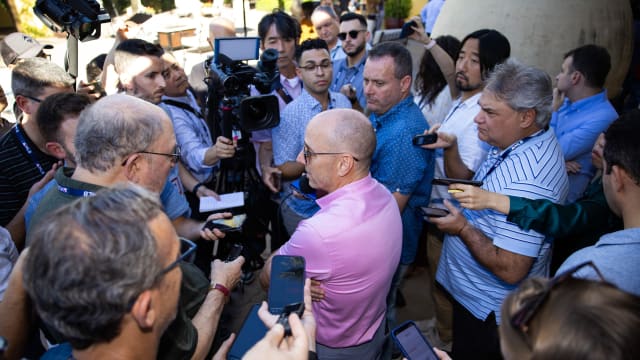 Yankees GM Brian Cashman surrounded by reporters at GM Meetings, November 7, 2023