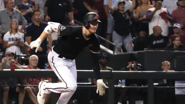 Pavin Smith bats in the 7th inning of Game 4 of the National League Championship Series.