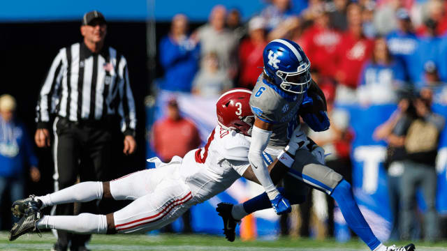 Kentucky Wildcats wide receiver Dane Key (6) carries the ball against Alabama Crimson Tide defensive back Terrion Arnold (3) during the second quarter at Kroger Field.
