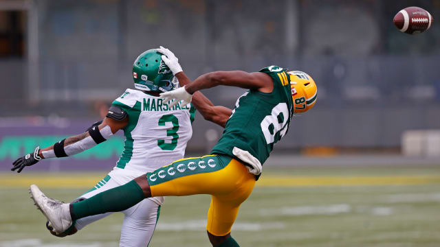Jun 11, 2023; Edmonton, Alberta, CAN; Saskatchewan Roughriders defensive back Nic Marshall (3) knocks the ball away from Edmonton Elks wide receiver Eugene Lewis (87) during the first quarter at Commonwealth Stadium. Mandatory Credit: Perry Nelson-USA TODAY Sports