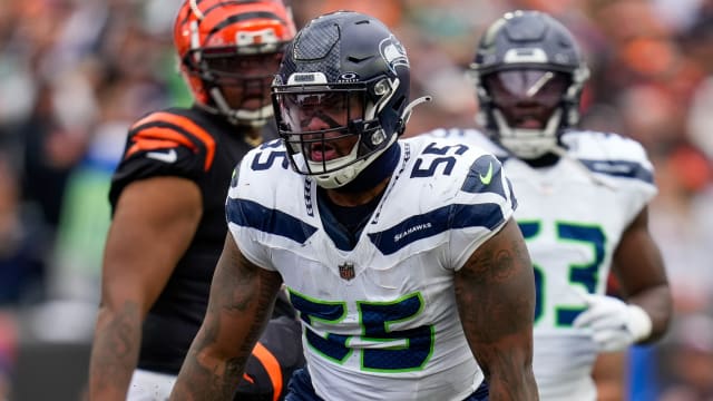Seattle Seahawks defensive end Dre'Mont Jones (55) celebrates after sacking Cincinnati Bengals quarterback Joe Burrow (9) in the third quarter of the NFL Week 6 game between the Cincinnati Bengals and the Seattle Seahawks at Paycor Stadium in downtown Cincinnati on Sunday, Oct. 15, 2023. 