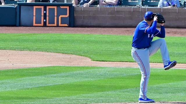Texas Rangers pitcher Dominic Leone starts his windup with two seconds left on the pitch clock during a spring training game against the Arizona Diamondbacks at Salt River Fields at Talking Stick in March 2023.