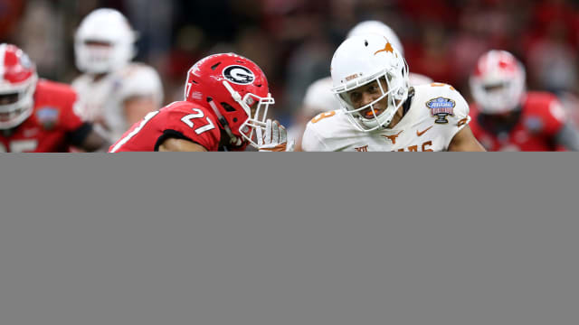 Jan 1, 2019; New Orleans, LA, USA; Texas Longhorns wide receiver Collin Johnson (9) runs against Georgia Bulldogs defensive back Eric Stokes (27) after a catch in the second half of the 2019 Sugar Bowl at the Mercedes-Benz Superdome. The Texas Longhorns won 28-21. Mandatory Credit: Chuck Cook-USA TODAY Sports