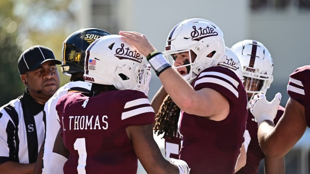 Nov 18, 2023; Starkville, Mississippi, USA; Mississippi State Bulldogs quarterback Will Rogers (2) reacts with wide receiver Zavion Thomas (1) after a touchdown against the Southern Miss Golden Eagles at Davis Wade Stadium at Scott Field. Mandatory Credit: Matt Bush-USA TODAY Sports