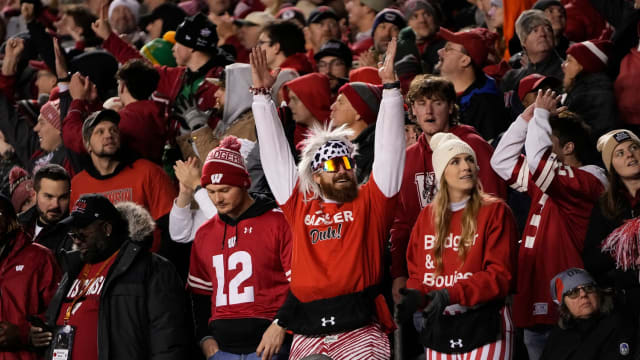 Oct 28, 2023; Madison, Wisconsin, USA; Wisconsin Badgers fans celebrate a touchdown during the second half of the NCAA football game against the Ohio State Buckeyes at Camp Randall Stadium. Ohio State won 24-10.