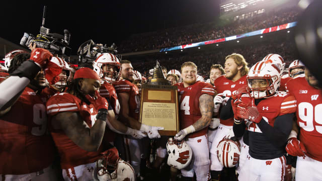 Nov 18, 2023; Madison, Wisconsin, USA; The Wisconsin Badgers celebrate with the Freedom Trophy following the game against the Nebraska Cornhuskers at Camp Randall Stadium. Mandatory Credit: Jeff Hanisch-USA TODAY Sports