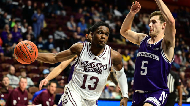 Mississippi State Bulldogs guard Josh Hubbard (13) dribbles the ball challenged by Northwestern Wildcats guard Ryan Langborg (5) during the second half at Mohegan Sun Arena.